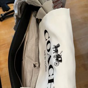 Black med size coach cross body bag .. never used